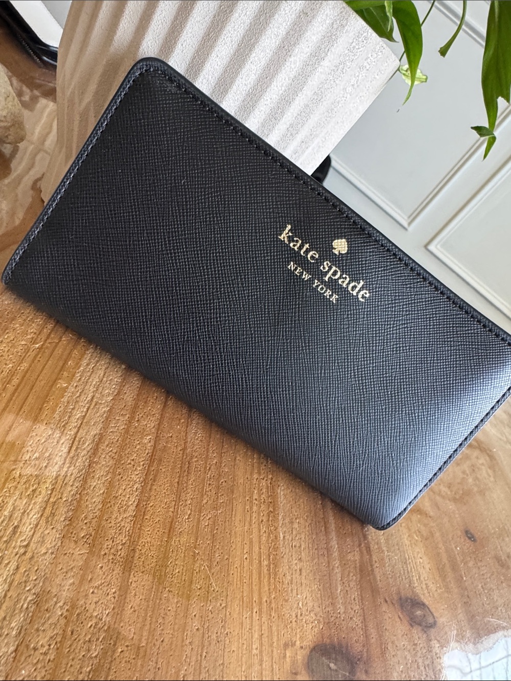 kate spade black zip-around wallet with gold logo